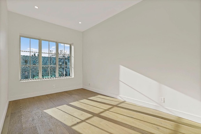 spare room with light hardwood / wood-style floors