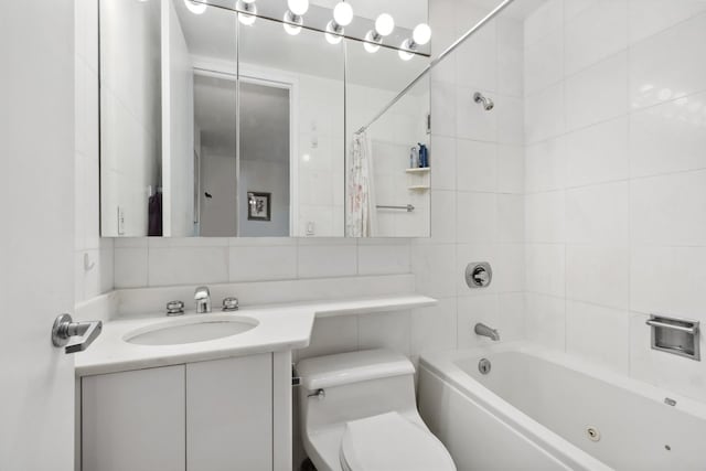 full bathroom featuring vanity, shower / bathtub combination with curtain, toilet, and tile walls
