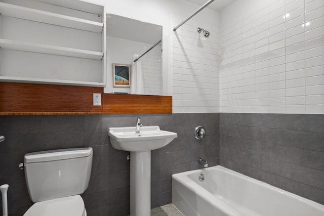 full bathroom featuring toilet, shower / tub combo, tile walls, and sink