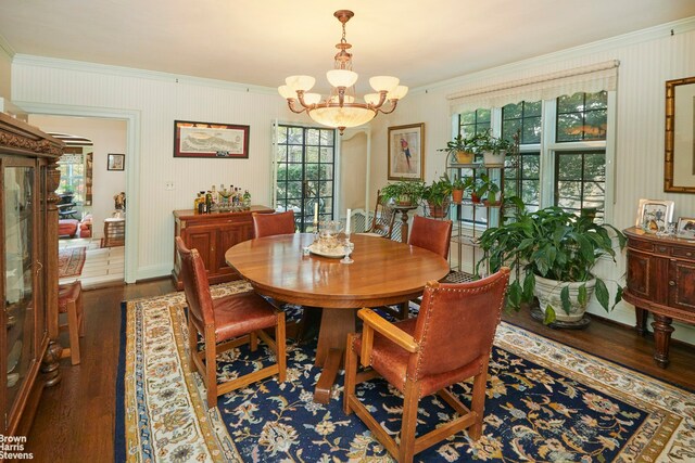 kitchen featuring sink, decorative backsplash, hanging light fixtures, black appliances, and light stone countertops