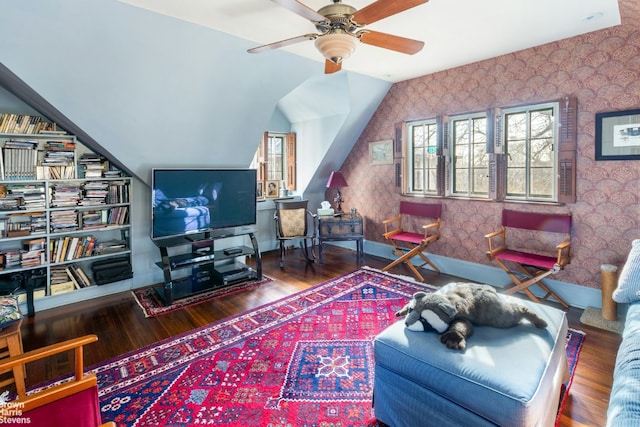 living room featuring lofted ceiling, hardwood / wood-style flooring, and ceiling fan