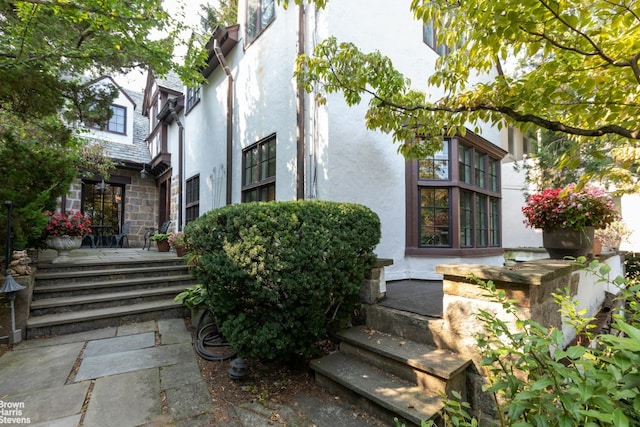 view of side of property with stucco siding