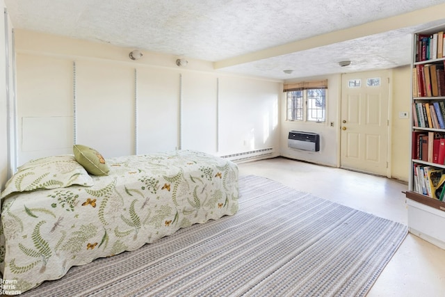 bedroom featuring baseboard heating, a textured ceiling, and heating unit