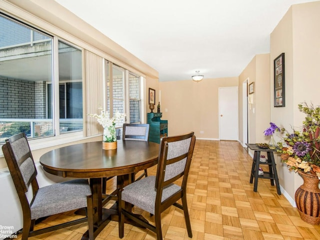 dining area with light parquet flooring