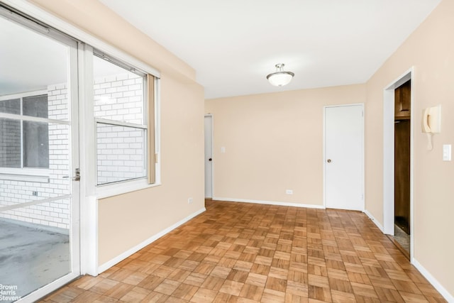 empty room with light parquet flooring