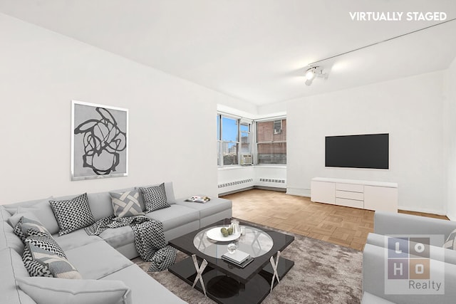 living room featuring cooling unit and radiator heating unit