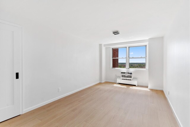 1655 Flatbush Ave Unit B1806, New York City, NY 11210 - empty room featuring light wood-type flooring and a baseboard heating unit