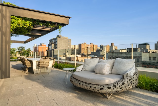 view of patio / terrace featuring outdoor lounge area and a city view