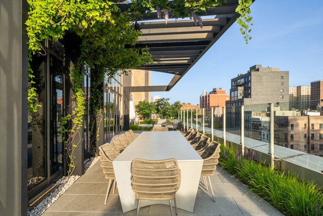 view of patio featuring a view of city and a pergola