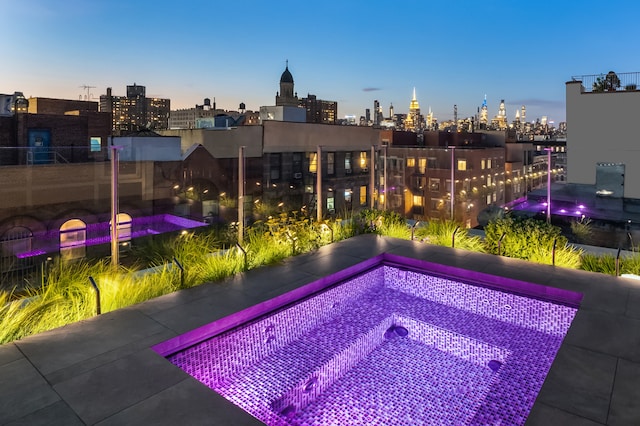 view of swimming pool with a view of city