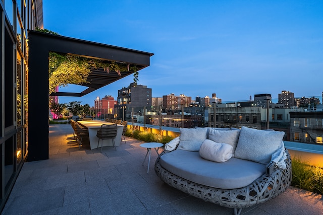 view of patio with a city view and an outdoor living space