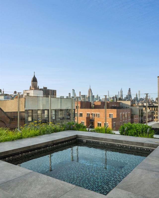 view of swimming pool featuring a view of city