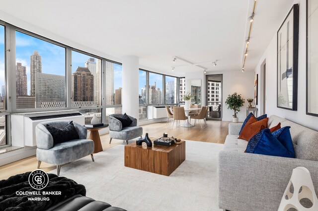 interior space with built in shelves and hardwood / wood-style floors