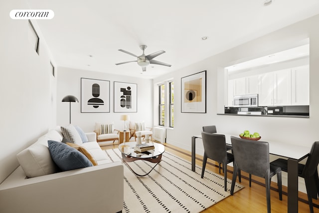 living area featuring visible vents, baseboards, ceiling fan, recessed lighting, and light wood-style flooring