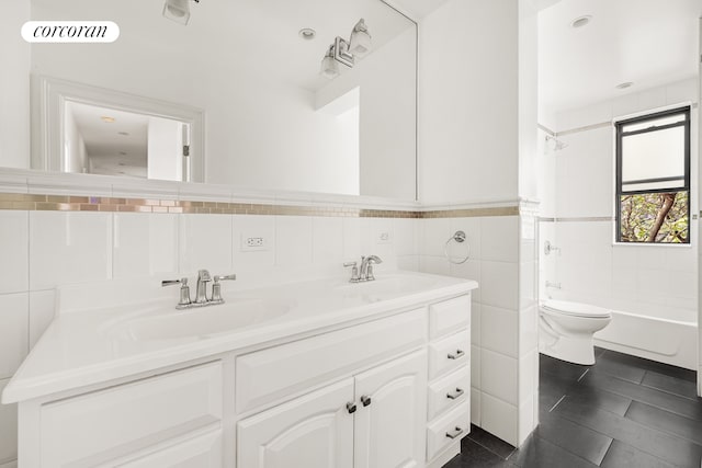 bathroom with visible vents, a sink, tile walls, and toilet