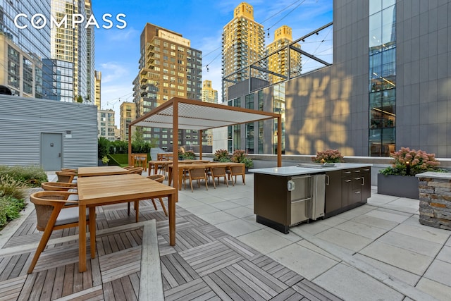 view of patio with a city view and outdoor dining area