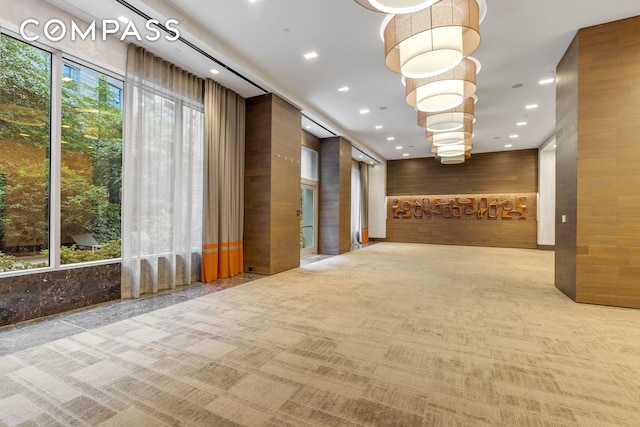 building lobby with wood walls and recessed lighting