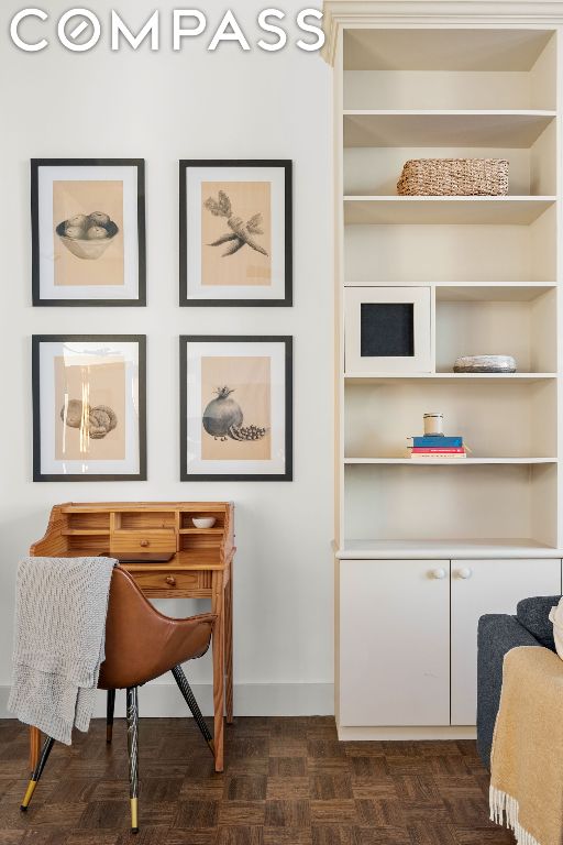 office featuring dark parquet flooring