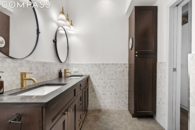 bathroom featuring tile walls, vanity, and tile patterned flooring