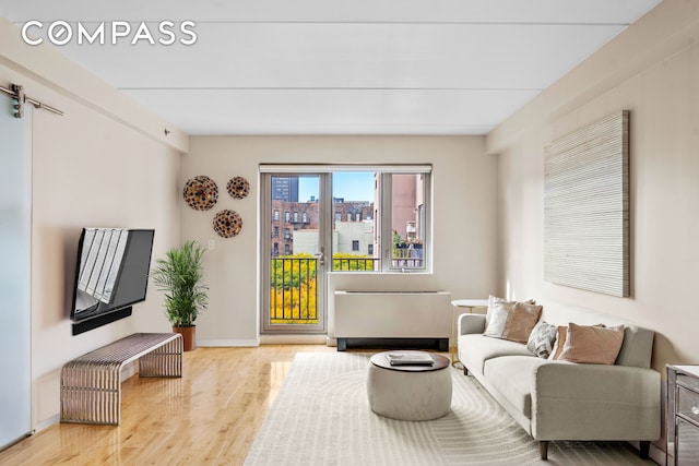 living room featuring baseboards and wood finished floors