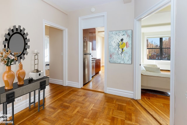 hall with light parquet floors