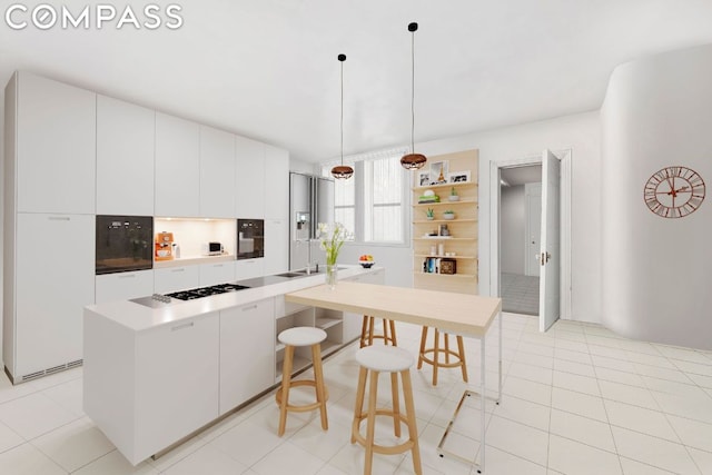 kitchen featuring white cabinetry, hanging light fixtures, light tile patterned floors, and white gas stovetop