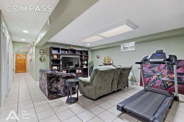 living room with a notable chandelier, hardwood / wood-style floors, and an AC wall unit