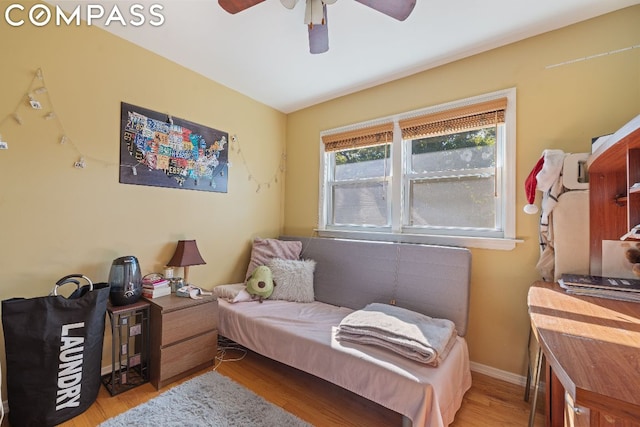 bedroom featuring ceiling fan and light hardwood / wood-style flooring