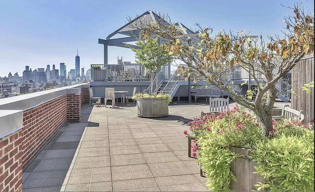 view of patio with a skyline view and a wooden deck