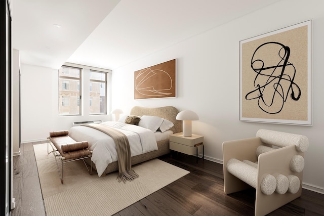 bedroom featuring dark wood finished floors and baseboards