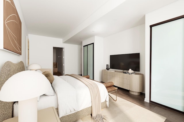 bedroom featuring wood finished floors