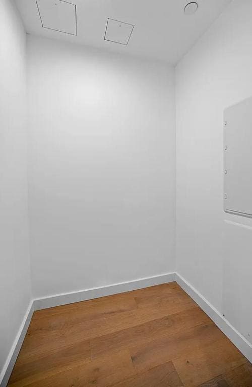 unfurnished room featuring hardwood / wood-style flooring