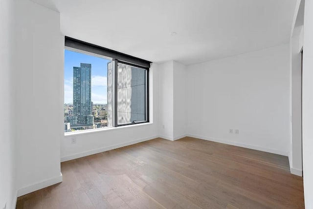 spare room featuring hardwood / wood-style flooring