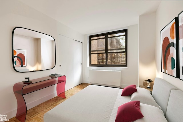 bedroom featuring light parquet floors