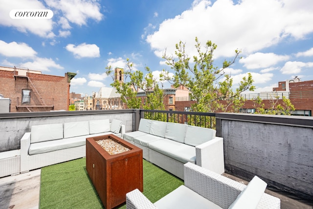 view of patio featuring an outdoor living space with a fire pit