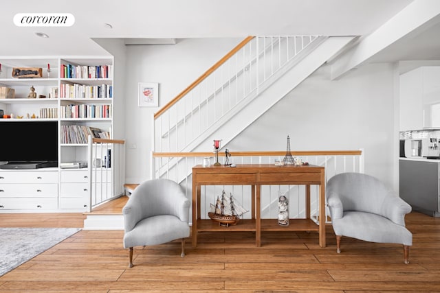 sitting room featuring visible vents and light wood finished floors