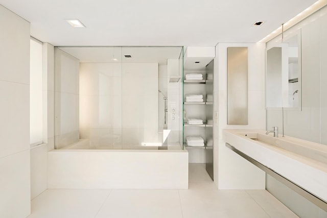 full bath with vanity, a shower, and tile patterned floors