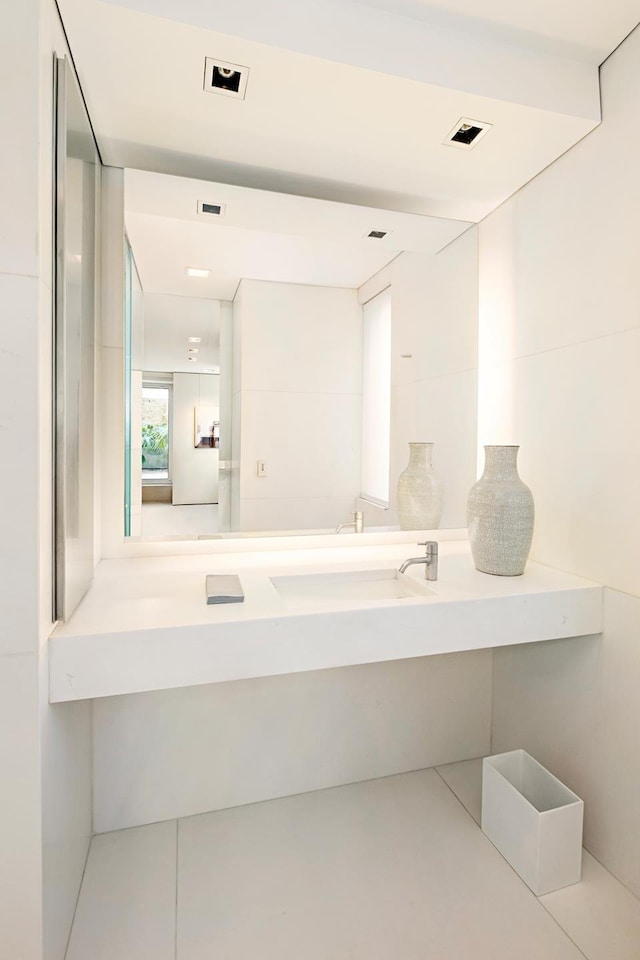 bathroom with vanity and visible vents