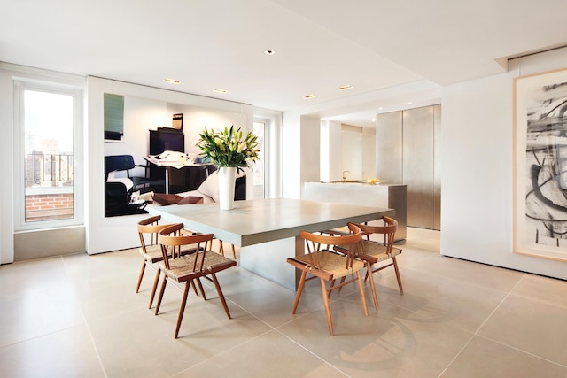 dining space with light tile patterned floors and recessed lighting