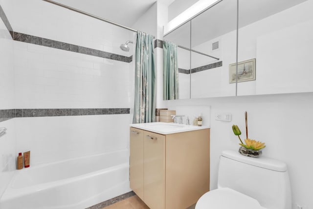 full bathroom featuring vanity, shower / tub combo, and toilet