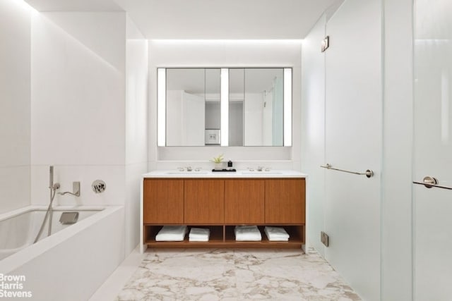 bathroom featuring vanity and a bathing tub