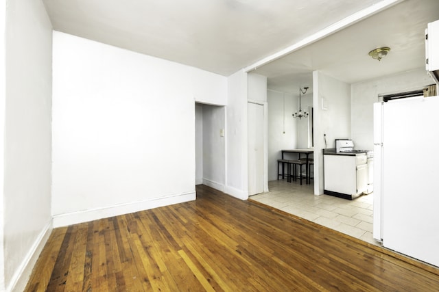 empty room with light hardwood / wood-style floors