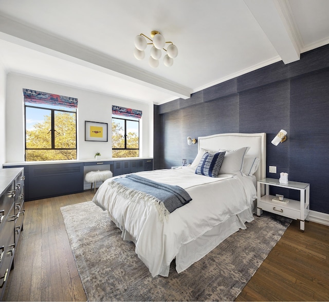 bedroom featuring beam ceiling, hardwood / wood-style flooring, crown molding, and baseboards