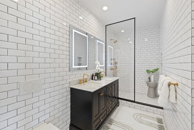 bathroom featuring walk in shower, vanity, and tile walls