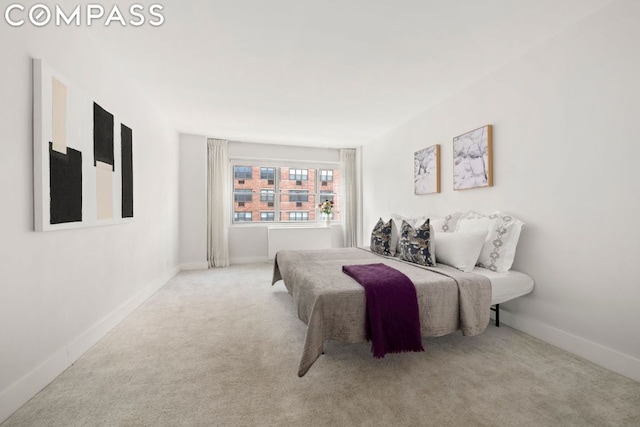 bedroom with carpet flooring and baseboards