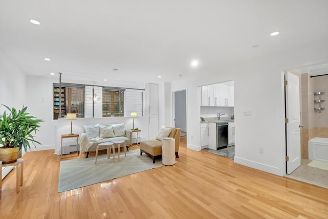 living room with light hardwood / wood-style flooring