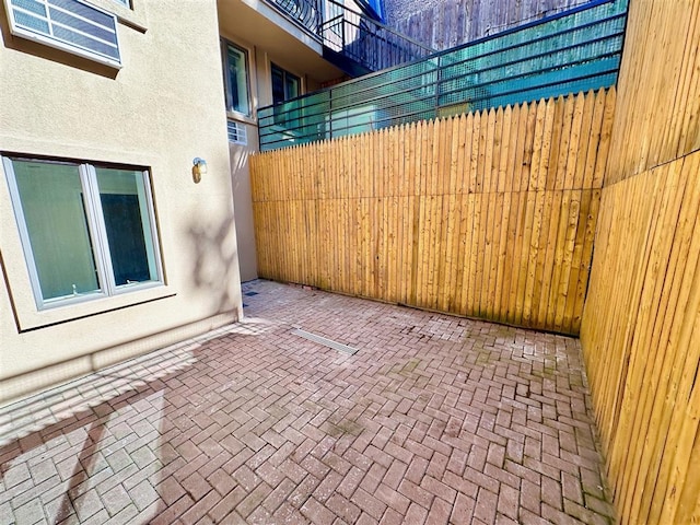 view of patio featuring fence