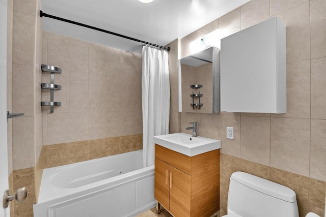 bathroom with toilet, vanity, shower / bath combination with curtain, and tile walls