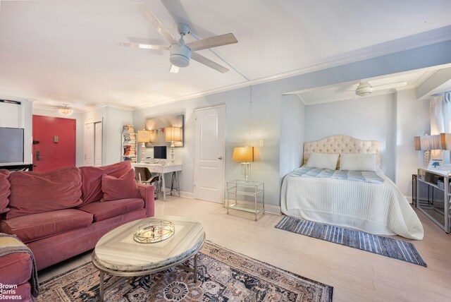 bedroom featuring ornamental molding and ceiling fan