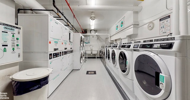 common laundry area with stacked washing maching and dryer and washing machine and clothes dryer